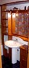 obile da bagno  abete lamellare con impianto d’illuminazione e specchio di varie tipologie. Come da foto cm 25 x 200 x h 220 COD. 007